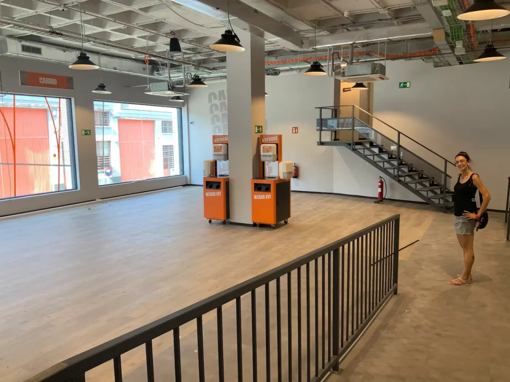 a room with stairs and orange boxes